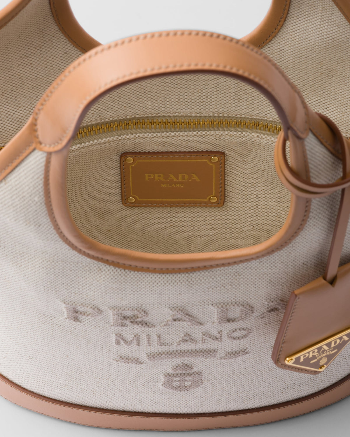 Prada Linen blend and leather mini-buckle bag